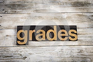 Grades Letterpress Word on Wooden Background