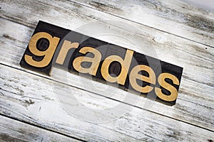 Grades Letterpress Word on Wooden Background photo