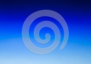 A gradient background blending from dark to light blue, creating a smooth transition from top to