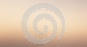 Gradient background with a soft transition from beige to light peach, creating a smooth