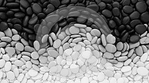 Gradient pattern of smooth pebbles creates a visual transition from dark