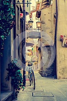 Grado-Friuli Venezia Giulia-italian alley with bike photo