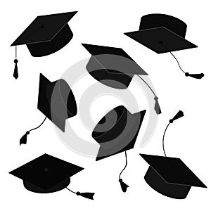 Graduate caps in the air. Vector cartoon illustration of grad hats in different positions isolated on white background photo