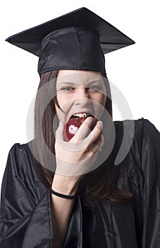 Graduate eating apple