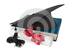 Graduate hat, book and scroll
