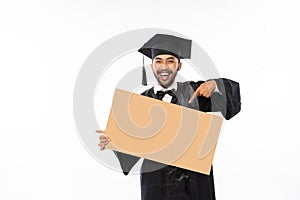 Graduate male students holding blank space carton with finger pointing