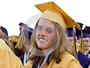 Graduate smiling in cap and gown