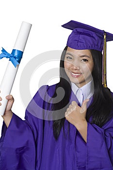 Graduate student holding her degree