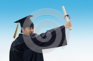 Graduate student with raised arm