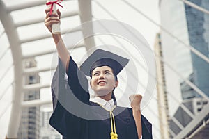Graduate Student and Success Education in University Concept. Happy Asian student woman graduate diploma and MBA degree in asian