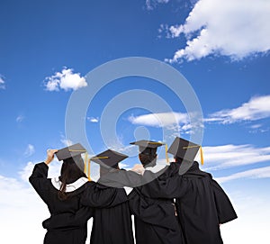 Graduate students looking at sky