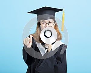 Graduate woman Shouting With Megaphone