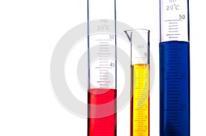 Graduated cylinders of colored chemicals photo