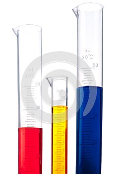 Graduated cylinders of different colored chemicals photo