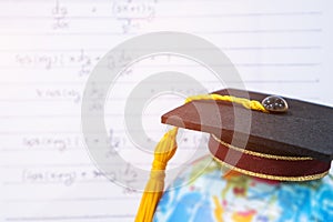 Graduated or Graduation university study  international Conceptual, Congratulations graduates hat on Earth world globe model with