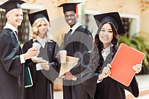 group of graduated multiethnic students with asian girl