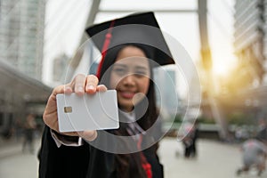 Graduated student holding a blank smart card in hand