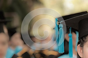 Graduates in commencement graduation ceremony row, metaphor educ