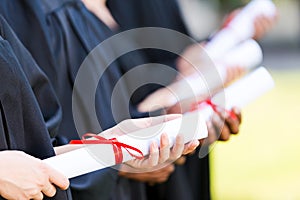 Graduates with diplomas.