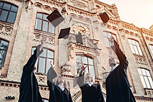 Graduates near university photo