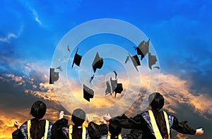 Graduates throwing graduation hats