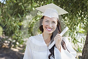 Graduating Mixed Race Girl In Cap and Gown with Diploma