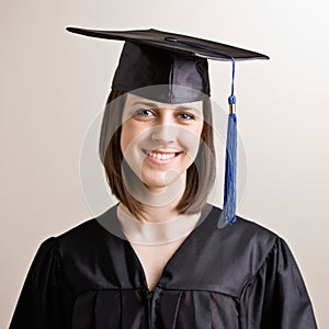 Graduating student wearing cap and gown