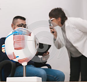 Graduation of a boy's eyesight by an optometrist