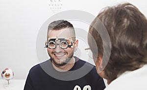 Graduation of a boy's eyesight by an optometrist