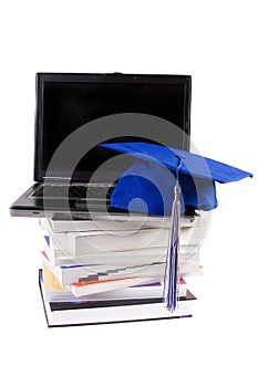 Graduation Cap, Books and Computer