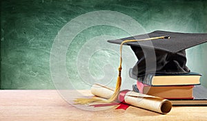 Graduation Cap And Diploma On Table