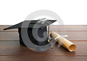 graduation cap, hat with degree paper and plane toy on wood table Empty ready for your product display or montage.
