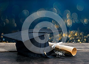 graduation cap, hat with degree paper on wood table, abstract li