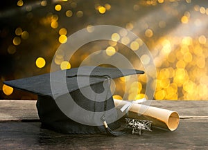 graduation cap, hat with degree paper on wood table, abstract li
