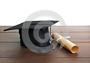 graduation cap, hat with degree paper on wood table Empty ready