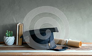 graduation cap, hat with degree paper on wood table graduation c