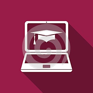 Graduation cap and laptop icon. Online learning or e-learning concept icon isolated with long shadow. Flat design