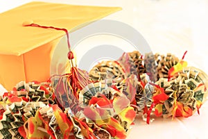Graduation cap and money ribbon lei