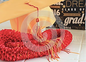 Graduation cap and silk lei