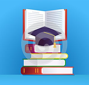 Graduation cap and stack of various books