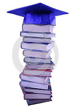 Graduation cap on top of book stack