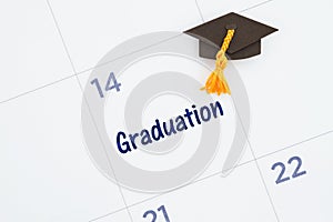 Graduation day message with a calendar with a grad hat