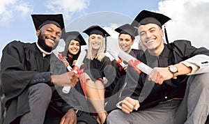 Graduation, group portrait and students celebrate success on sky background. Happy international graduates, friends and