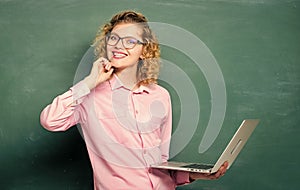 graduation. modern technology. girl in modern school. teacher woman at blackboard. happy student in glasses with laptop