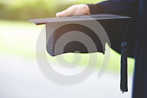 Graduation,Student hold hats in hand during commencement success graduates of the university,Concept education congratulation.Grad