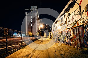 Graffiti Alley at night, in the Station North District, of Baltimore, Maryland.