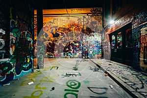 Graffiti Alley at night, in the Station North District, of Baltimore, Maryland.