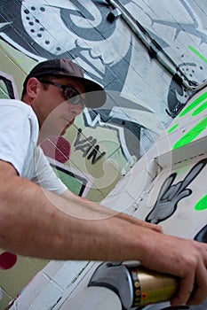 Graffiti Artist At Work On Mural
