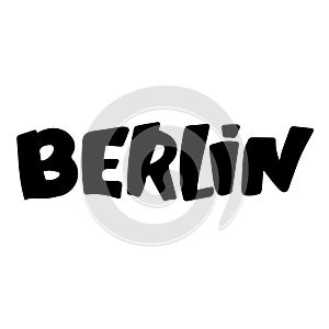 graffiti Berlin word sprayed in black over white.