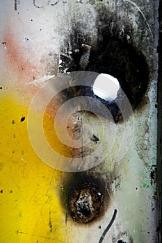 Graffiti with burned hole